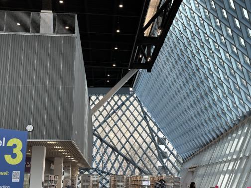 The third floor of the Seattle Central Library — a grid of beams forming a high open space.